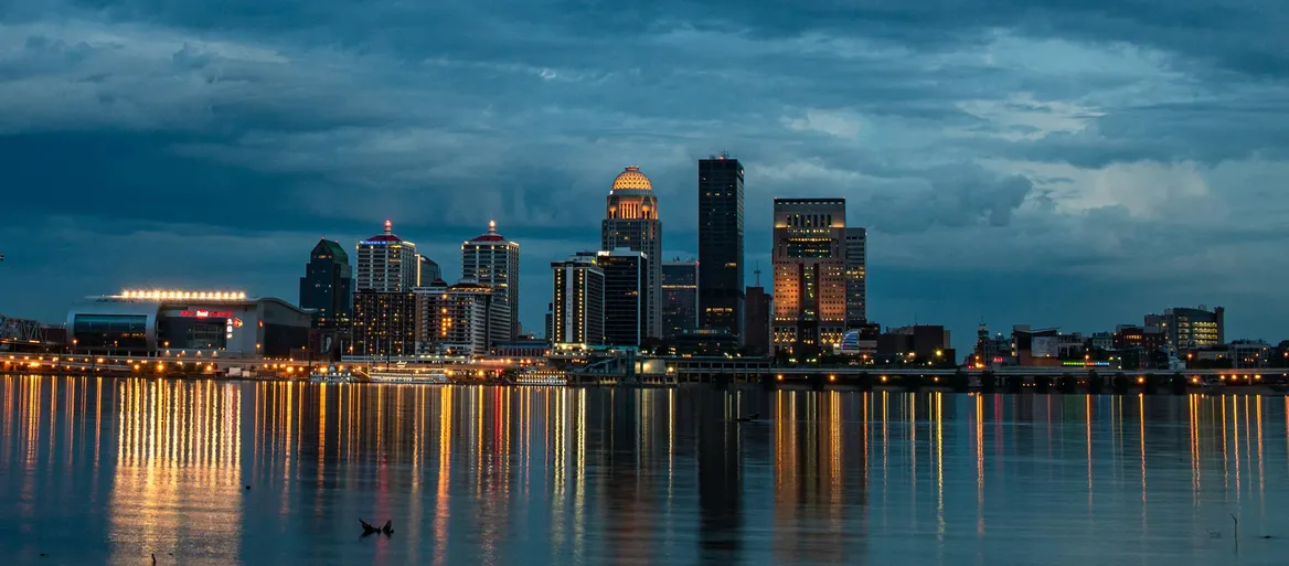 The Louisville skyline at dusk, seen across the Ohio River from Clarksville, Indiana